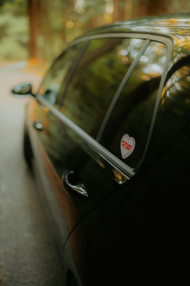 Black car with tinted windows.