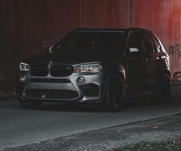black car parked in red wall